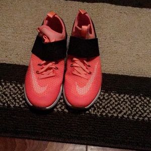 Neon orange Nike shoes